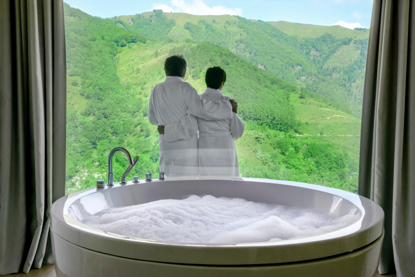 Couple contemplates the landscape from their room